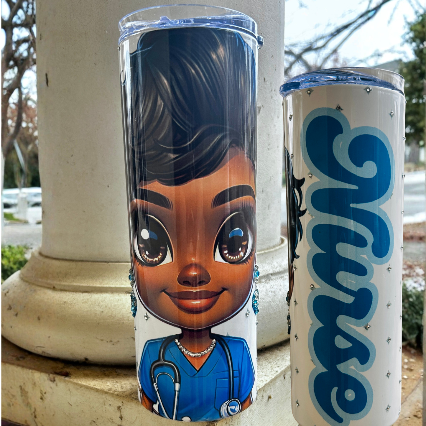 “20oz tumbler with chibi Black nurse and ‘Nurse’ text in blue rhinestones.”